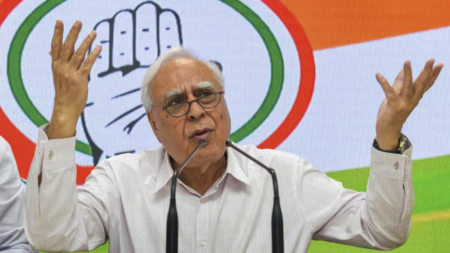PM should attend to work, have less photo ops: Sibal